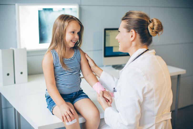 Provider with pediatric patient Provider with pediatric patient
